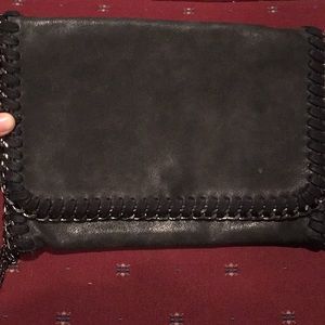 Black clutch purse with chain strap and detailing